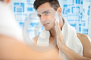 Man putting on shaving cream