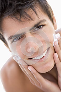 Man putting on shaving cream