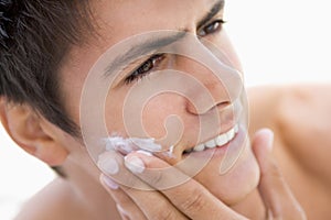 Man putting on shaving cream