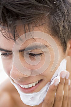 Man putting on shaving cream