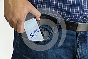 Man putting a smartphone with 5g danger warning