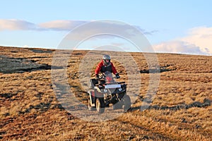 Man on a quad bike on Nateby Common