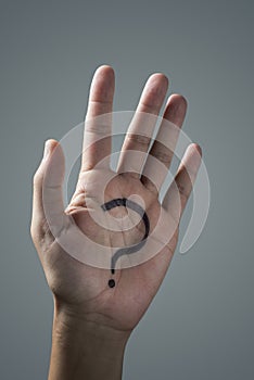 Question mark in the palm of a man