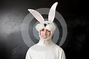 Man in a rabbit costume smiling