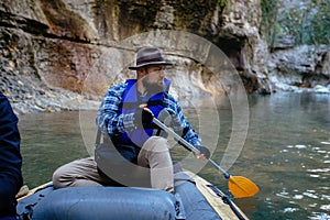 Man in rafting boat in the canyon