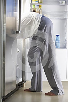 Man Raiding The Fridge At Night