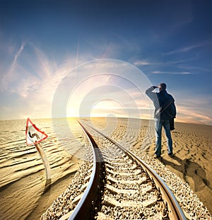 Man and railway in desert