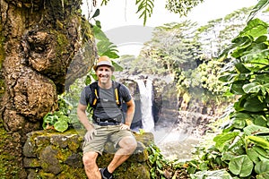 A man at The Rainbow Falls, Hilo, Wailuku River State Park, Big Island, Hawaii