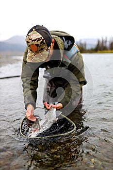 Man with rainbow trout