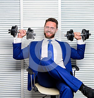 Man raise heavy dumbbells. Boss businessman manager raise hands with dumbbells. Sport healthy lifestyle. Successful in