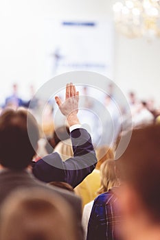 Man raising hand during a congregation in a church
