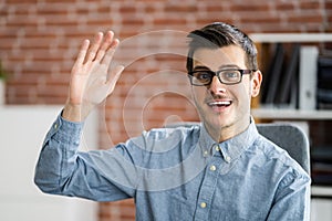 Man Raising Hand In Video Conference Call