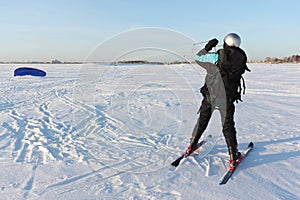 Man raising kite on the snow, Ob reservoir, Novosibirsk, Russia