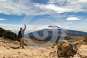 Man reached the top of the mountain.hiker observes the orizonte in the chasm of the Iztaccihuatl volcano Popocatepetl National