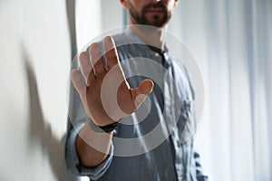 Man reaching for something, closeup of hand.