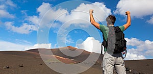 Man reaching the top of mountain.