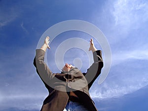 Man Reaching Up to the Sky