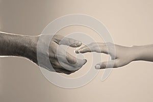Man reaching for woman`s hand on color background