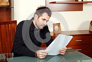 Man is reading agreement