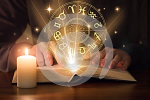 Man reading astrology book photo