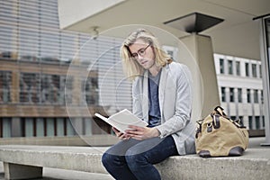 Man reading on a bench