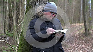 Man reading Bible at outdoor