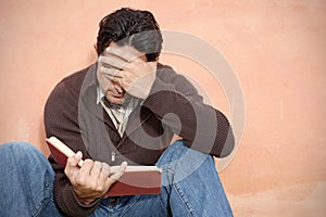 Man reading book or bible