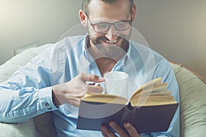 Man reading book with coffee