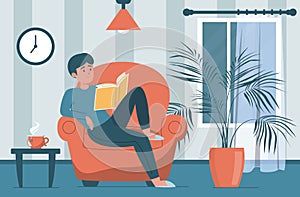 Man reading book sitting in the armchair