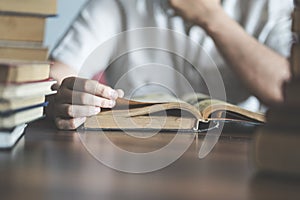 Man reading book on the table