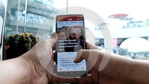 A man reading CNN News on mobile application,Bangkok,Thailand,Jan21 ,2020