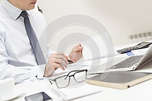 Man reading document in office