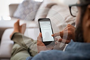 Man reading email on smartphone photo