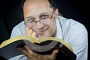 Man Reading Holy Bible