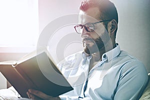 Man reading interesting book