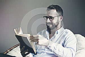 Man reading interesting book