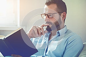 Man reading interesting book