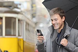 Man reading message in a smart phone