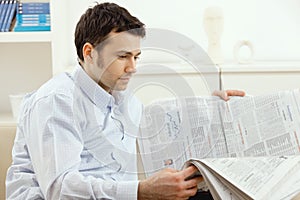 Man reading newspaper