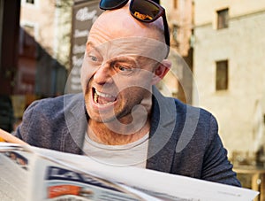 Man reading newspaper