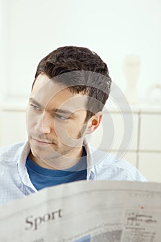 Man reading newspaper