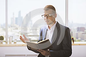 Man reading notes in notepad