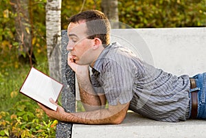 Man Reading A Novel