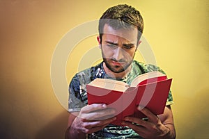 Man reading a sad book