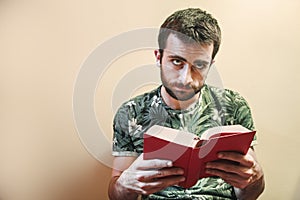 Man reading a sad book