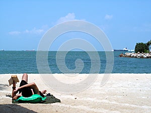 Man reading at seaside