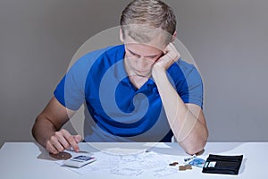 Man reading unpaid bills