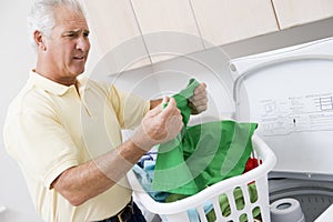 Man Reading Washing Instructions