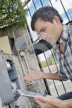 Man reading water/electric meter