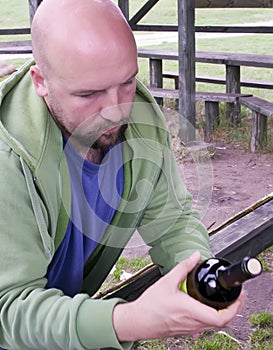 Man reading wine label